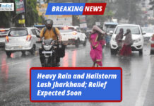 Heavy Rain and Hailstorm Lash Jharkhand; Relief Expected Soon People and vehicles struggle on a rain-soaked road during heavy rainfall and hailstorm in Jharkhand.