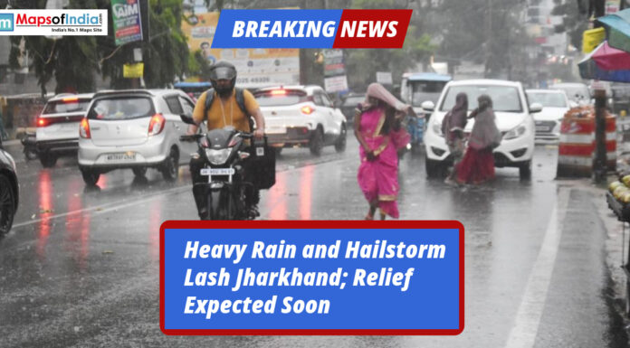 Heavy Rain and Hailstorm Lash Jharkhand; Relief Expected Soon People and vehicles struggle on a rain-soaked road during heavy rainfall and hailstorm in Jharkhand.