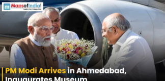 PM Modi Arrives in Ahmedabad, Inaugurates Museum Narendra Modi being welcomed with a bouquet upon arrival in Ahmedabad near an aircraft, marking his visit to inaugurate a museum.