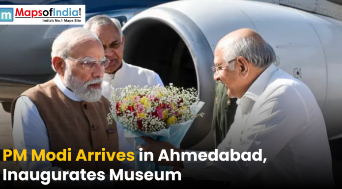 PM Modi Arrives in Ahmedabad, Inaugurates Museum Narendra Modi being welcomed with a bouquet upon arrival in Ahmedabad near an aircraft, marking his visit to inaugurate a museum.