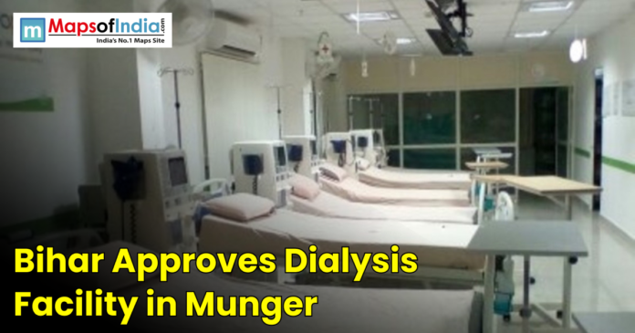 Hospital ward with a row of dialysis machines and beds.