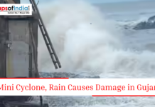 Mini Cyclone, Rain Causes Damage in Gujarat Large sea waves crashing near a coastal structure with text about mini cyclone and rain damage in Gujarat.
