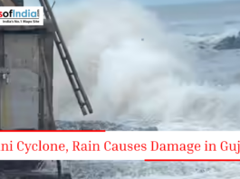 Large sea waves crashing near a coastal structure with text about mini cyclone and rain damage in Gujarat.