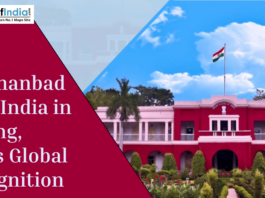 Banner showing IIT Dhanbad campus with Indian flag and text highlighting its top ranking in mining and global recognition.