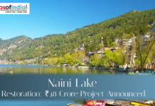 Naini Lake Restoration: ₹38 Crore Project Announced Scenic view of Naini Lake in Nainital surrounded by green hills and lakeside buildings, highlighting the ₹38 crore lake restoration project announcement.