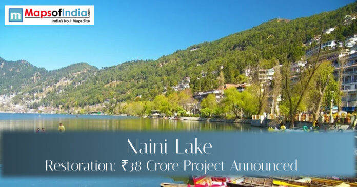 Scenic view of Naini Lake in Nainital surrounded by green hills and lakeside buildings, highlighting the ₹38 crore lake restoration project announcement.