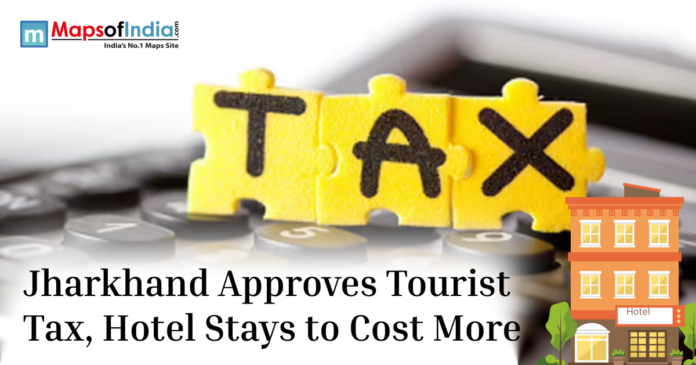 Illustration showing “TAX” written on puzzle pieces over a calculator with the headline about Jharkhand approving a tourist tax that may increase hotel stay costs.