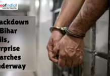 Crackdown in Bihar Jails, Surprise Searches Underway Close-up of a prisoner’s hands in handcuffs inside a jail, highlighting crackdown and surprise searches in Bihar prisons.