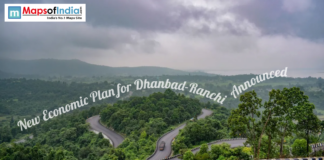 New Economic Plan for Dhanbad-Ranchi Announced Scenic winding road through lush green hills between Dhanbad and Ranchi under cloudy skies highlighting regional landscape