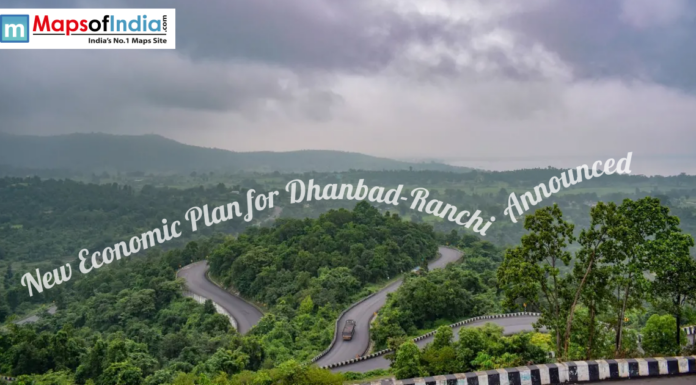 New Economic Plan for Dhanbad-Ranchi Announced Scenic winding road through lush green hills between Dhanbad and Ranchi under cloudy skies highlighting regional landscape