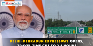 Delhi–Dehradun Expressway Opens, Travel Time Cut to 2.5 Hours Narendra Modi next to a Delhi-Dehradun Expressway sign.