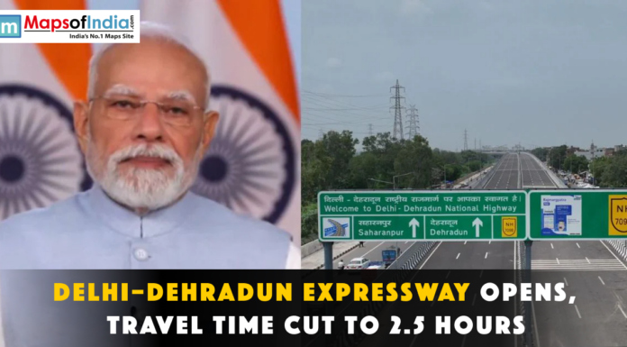 Delhi–Dehradun Expressway Opens, Travel Time Cut to 2.5 Hours Narendra Modi next to a Delhi-Dehradun Expressway sign.