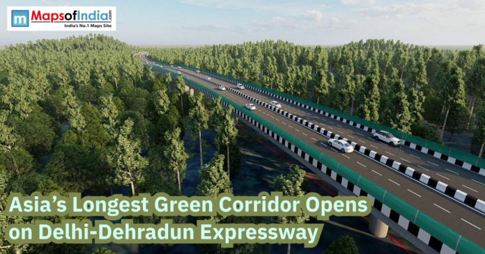 Aerial view of the Delhi-Dehradun Expressway passing through dense forest, highlighting Asia’s longest green corridor with vehicles on a modern highway.