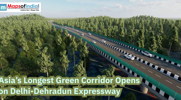 Asia’s Longest Green Corridor Opens on Delhi-Dehradun Expressway Aerial view of the Delhi-Dehradun Expressway passing through dense forest, highlighting Asia’s longest green corridor with vehicles on a modern highway.