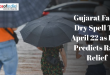 Gujarat Faces Dry Spell Till April 22 as IMD Predicts Rain Relief People carrying umbrellas during rainy weather illustrate Gujarat’s dry spell and forecast of rain relief by IMD.