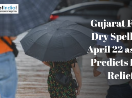 People carrying umbrellas during rainy weather illustrate Gujarat’s dry spell and forecast of rain relief by IMD.