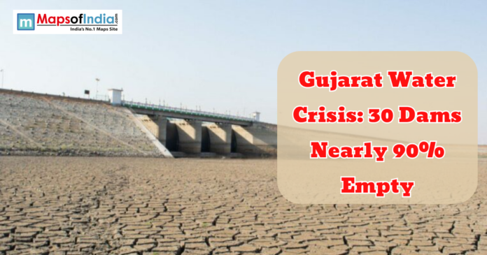 Gujarat water Dried reservoir with cracked land near a dam in Gujarat highlighting severe water crisis as many dams are nearly empty.