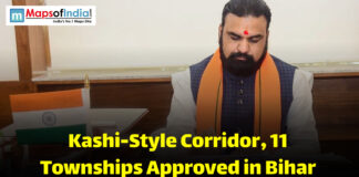 Kashi-Style Corridor, 11 Townships Approved in Bihar A government official in Bihar signing documents related to approval of a Kashi-style corridor and new townships