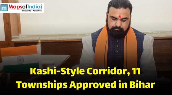 Kashi-Style Corridor, 11 Townships Approved in Bihar A government official in Bihar signing documents related to approval of a Kashi-style corridor and new townships