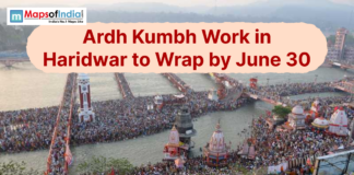 Ardh Kumbh Work in Haridwar to Wrap by June 30 Aerial view of a crowded Har ki Pauri in Haridwar with Ardh Kumbh work update text.