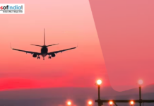 Jharkhand Small Cities to Get Flights Under UDAN Airplane landing at sunset with runway lights glowing, symbolizing aviation connectivity and regional air travel in India.