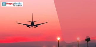 Jharkhand Small Cities to Get Flights Under UDAN Airplane landing at sunset with runway lights glowing, symbolizing aviation connectivity and regional air travel in India.
