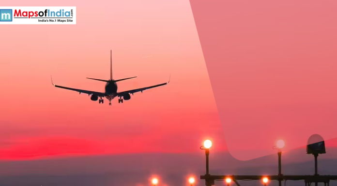 Jharkhand Small Cities to Get Flights Under UDAN Airplane landing at sunset with runway lights glowing, symbolizing aviation connectivity and regional air travel in India.