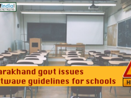 Empty classroom with desks and blackboard as Uttarakhand government issues heatwave guidelines for schools, highlighted by a heat warning sign.