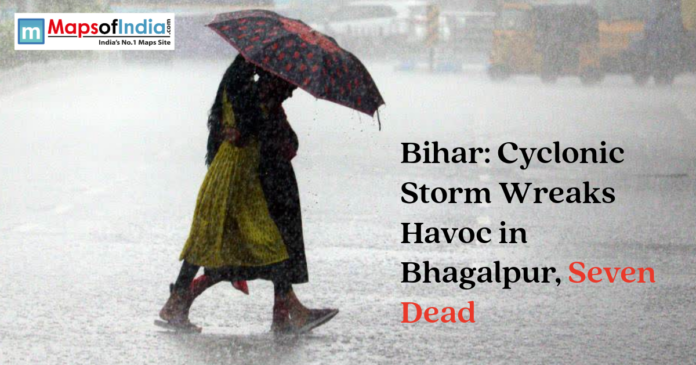 People walking in heavy rain with an umbrella under a headline about a cyclonic storm in Bhagalpur, Bihar.