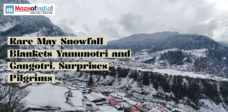 Rare May Snowfall Blankets Yamunotri and Gangotri, Surprises Pilgrims Snow-covered landscape in Yamunotri and Gangotri after rare May snowfall, with mountains, houses, and cloudy skies.