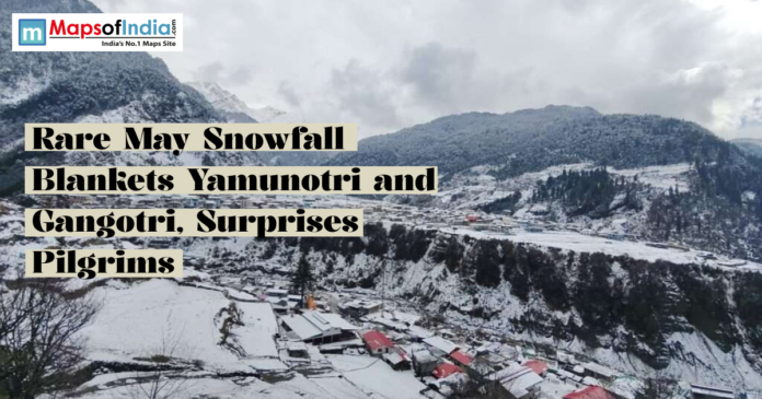 Snow-covered landscape in Yamunotri and Gangotri after rare May snowfall, with mountains, houses, and cloudy skies.