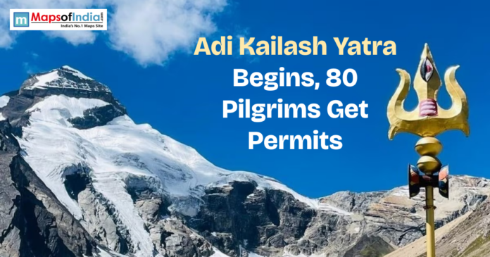 Snow-covered Adi Kailash mountain with trident and text “Adi Kailash Yatra Begins, 80 Pilgrims Get Permits”