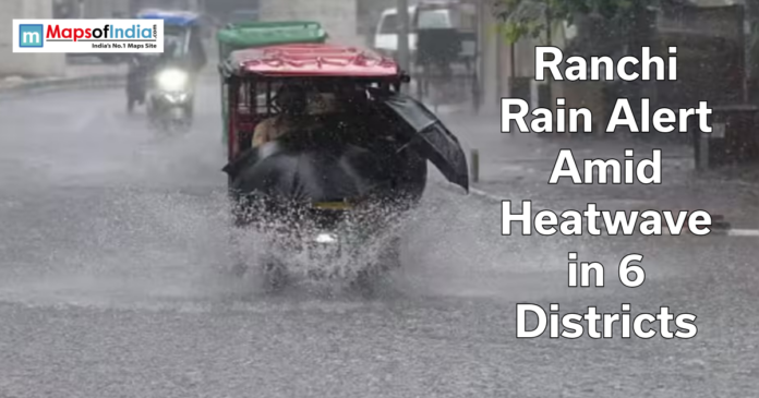 Auto-rickshaw driving through heavy rain on a flooded road in Ranchi with text overlay about rain alert amid heatwave in six districts.