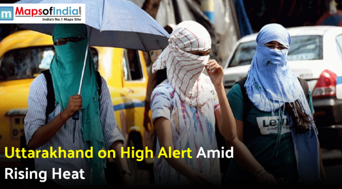 Uttarakhand on High Alert Amid Rising Heat Three people with faces covered walking outdoors under an umbrella during a heatwave.