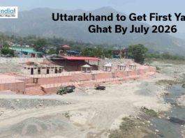 View of the newly developed Yamuna Ghat in Uttarakhand with riverbank structures, mountains, and text announcing completion by July 2026.