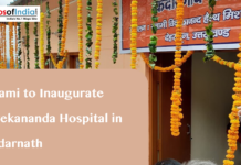 Dhami to Inaugurate Vivekananda Hospital in Kedarnath A building decorated with marigold garlands and a banner in Hindi, with text overlaying "Dhami to Inaugurate Vivekananda Hospital in Kedarnath" and the Maps of India logo.