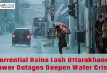 Torrential Rains Lash Uttarakhand, Power Outages Deepen Water Crisis Heavy rainfall floods a city street as pedestrians use umbrellas and vehicles move through waterlogged roads in Uttarakhand