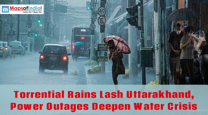 Torrential Rains Lash Uttarakhand, Power Outages Deepen Water Crisis Heavy rainfall floods a city street as pedestrians use umbrellas and vehicles move through waterlogged roads in Uttarakhand