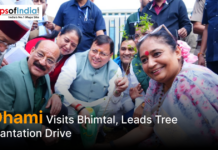 Dhami Visits Bhimtal, Leads Tree Plantation Drive Uttarakhand Chief Minister Pushkar Singh Dhami participates in a tree plantation drive during his visit to Bhimtal, surrounded by officials and local residents.