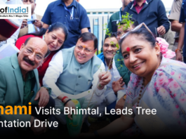 Uttarakhand Chief Minister Pushkar Singh Dhami participates in a tree plantation drive during his visit to Bhimtal, surrounded by officials and local residents.