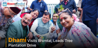 Dhami Visits Bhimtal, Leads Tree Plantation Drive Uttarakhand Chief Minister Pushkar Singh Dhami participates in a tree plantation drive during his visit to Bhimtal, surrounded by officials and local residents.