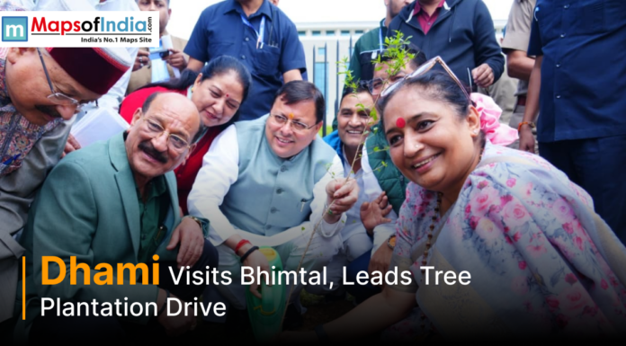 Dhami Visits Bhimtal, Leads Tree Plantation Drive Uttarakhand Chief Minister Pushkar Singh Dhami participates in a tree plantation drive during his visit to Bhimtal, surrounded by officials and local residents.