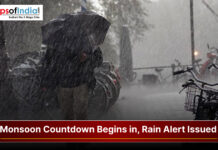 Monsoon Countdown Begins in Uttarakhand, Rain Alert Issued Heavy rainfall during monsoon season with a rain alert warning and people using umbrellas on a city street.