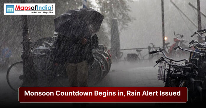 Heavy rainfall during monsoon season with a rain alert warning and people using umbrellas on a city street.