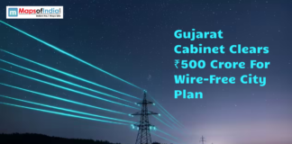Gujarat Cabinet Clears ₹500 Crore For Wire-Free City Plan Graphic showing power transmission lines at night with the headline "Gujarat Cabinet Clears ₹500 Crore for Wire-Free City Plan" and the Maps of India logo.