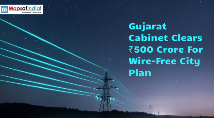 Gujarat Cabinet Clears ₹500 Crore For Wire-Free City Plan Graphic showing power transmission lines at night with the headline "Gujarat Cabinet Clears ₹500 Crore for Wire-Free City Plan" and the Maps of India logo.